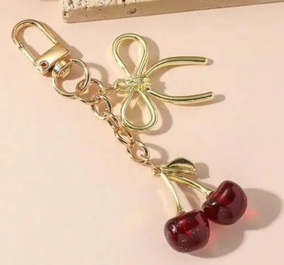 Corehide™ 1pc Unisex Red Cherry Shaped Keychain With Fashionable Bow Pendant, Luxury Handbag Key Ring Accessory For Mother's Day Eid al Ad