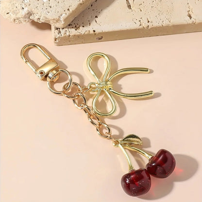 Corehide™ 1pc Unisex Red Cherry Shaped Keychain With Fashionable Bow Pendant, Luxury Handbag Key Ring Accessory For Mother's Day Eid al Ad